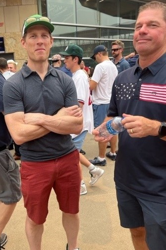 Picture of Matt Nelson and Matt Finley being caught in the act talking shop at a team outing to the Minnesota Twins game.